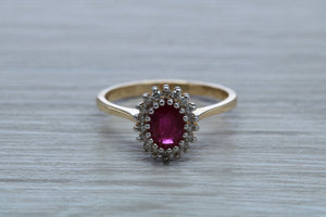 Oval cut Ruby and Diamond Cluster Ring