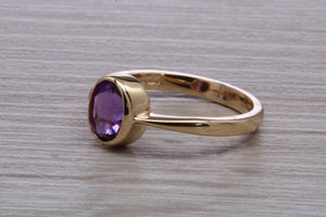 Oval cut Natural Amethyst set Yellow Gold Ring
