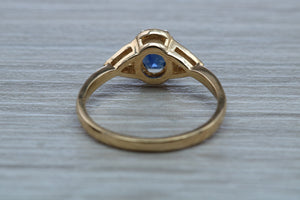 Oval cut Blue Sapphire and Diamond Ring