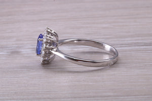 One and Half carat AAA Grade Tanzanite and Diamond Halo Ring