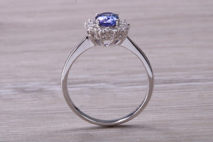 One and Half carat AAA Grade Tanzanite and Diamond Halo Ring