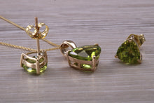 Load image into Gallery viewer, Trillion cut Peridot Earrings and Matching Necklace set Yellow Gold