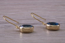 Load image into Gallery viewer, Oval cut Blue Topaz set Yellow Gold Dropper Earrings