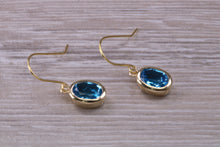 Load image into Gallery viewer, Oval cut Blue Topaz set Yellow Gold Dropper Earrings