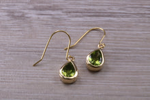 Load image into Gallery viewer, Tear Drop cut Peridot set Dropper Earrings set in Yellow gold