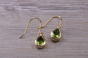 Tear Drop cut Peridot set Dropper Earrings set in Yellow gold