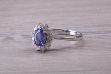 Load image into Gallery viewer, One and Half carat AAA Grade Tanzanite and Diamond Halo Ring