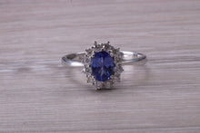 Load image into Gallery viewer, One and Half carat AAA Grade Tanzanite and Diamond Halo Ring