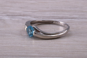 Round cut Blue Topaz set White Gold Ring