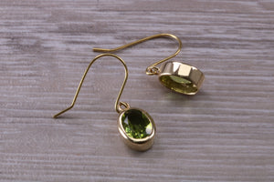 Natural Oval cut Peridot dropper earrings, set in solid 9ct Yellow gold