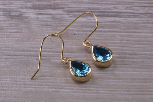 Tear Drop cut Swiss Blue Topaz Dropper Earrings set in Yellow gold