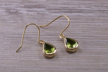 Load image into Gallery viewer, Tear Drop cut Peridot set Dropper Earrings set in Yellow gold