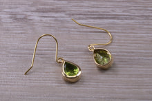 Load image into Gallery viewer, Tear Drop cut Peridot set Dropper Earrings set in Yellow gold