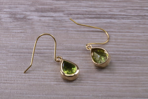 Tear Drop cut Peridot set Dropper Earrings set in Yellow gold