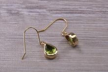 Load image into Gallery viewer, Tear Drop cut Peridot set Dropper Earrings set in Yellow gold