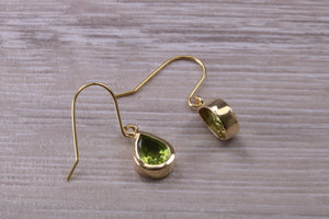 Tear Drop cut Peridot set Dropper Earrings set in Yellow gold