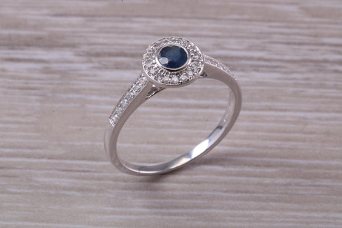 Beautiful Blue Sapphire and Halo set Diamond Ring