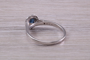 Beautiful Blue Sapphire and Halo set Diamond Ring