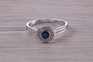 Beautiful Blue Sapphire and Halo set Diamond Ring