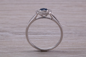 Beautiful Blue Sapphire and Halo set Diamond Ring