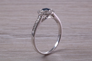 Beautiful Blue Sapphire and Halo set Diamond Ring