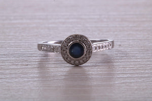 Beautiful Blue Sapphire and Halo set Diamond Ring