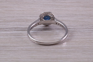 Beautiful Blue Sapphire and Halo set Diamond Ring