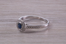 Load image into Gallery viewer, Beautiful Blue Sapphire and Halo set Diamond Ring