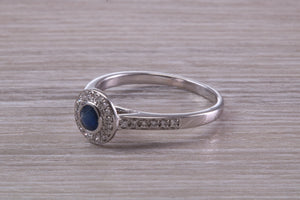 Beautiful Blue Sapphire and Halo set Diamond Ring