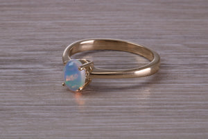 Oval cut Natural Opal set Yellow Gold Ring