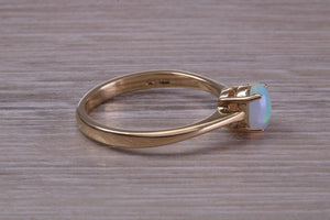 Oval cut Natural Opal set Yellow Gold Ring