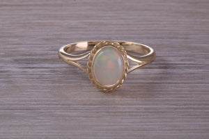 Oval cut Natural Opal set Yellow Gold Ring