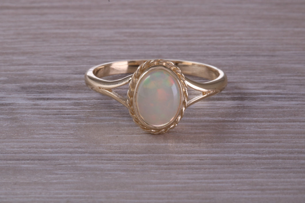 Oval cut Natural Opal set Yellow Gold Ring