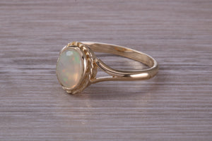 Oval cut Natural Opal set Yellow Gold Ring