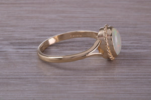 Oval cut Natural Opal set Yellow Gold Ring