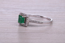 Load image into Gallery viewer, Square cut Natural Emerald Halo and Shoulder set With Diamonds in This 18ct White Gold Ring