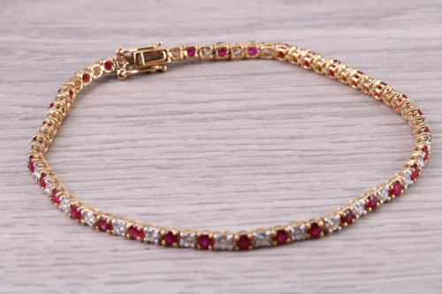 Four carats Natural Rubies and Diamonds set Solid Yellow Gold Tennis Bracelet, British Hallmarked