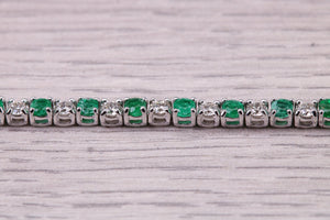 Four and Half carats Natural Emeralds and Diamonds set White Gold Tennis Bracelet, British Hallmarked