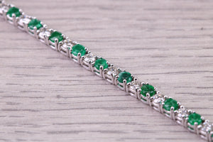 Four and Half carats Natural Emeralds and Diamonds set White Gold Tennis Bracelet, British Hallmarked