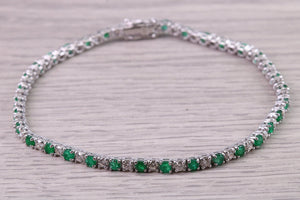 Four and Half carats Natural Emeralds and Diamonds set White Gold Tennis Bracelet, British Hallmarked