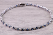 Load image into Gallery viewer, Five carats Natural Blue Sapphire and Diamonds set White Gold Tennis Bracelet, British Hallmarked