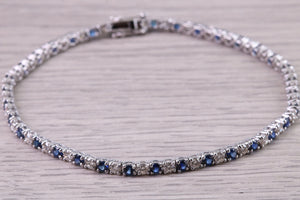 Five carats Natural Blue Sapphire and Diamonds set White Gold Tennis Bracelet, British Hallmarked