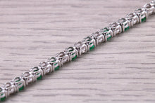 Load image into Gallery viewer, Four and Half carats Natural Emeralds and Diamonds set White Gold Tennis Bracelet, British Hallmarked