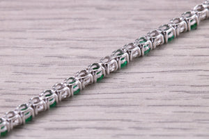 Four and Half carats Natural Emeralds and Diamonds set White Gold Tennis Bracelet, British Hallmarked