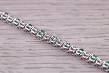 Load image into Gallery viewer, Four and Half carats Natural Emeralds and Diamonds set White Gold Tennis Bracelet, British Hallmarked