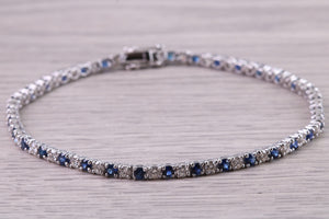 Five carats Natural Blue Sapphire and Diamonds set White Gold Tennis Bracelet, British Hallmarked